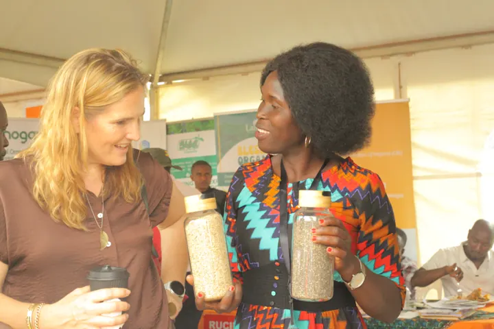 Two participants speaking at an agricultural exhibition.